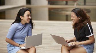 Two students on campus talking