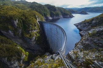 A view of a dam amidst mountainous terrain