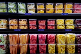 Fresh cut fruit in plastic containers in local supermarket