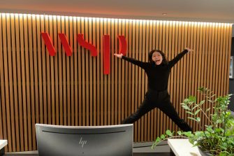 Rosanna Jumping in front of WSP Sign