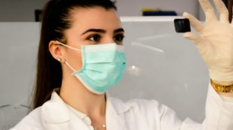 Female engineer looking at components