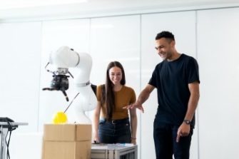 Female and male robotics engineer