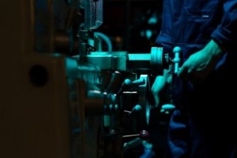 dark shot of Engineer turning levers