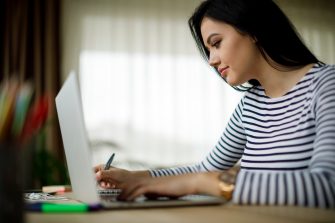 Young woman working at home