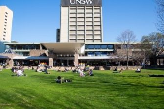 UNSW logo on building and courtyard