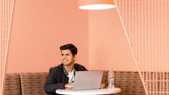 Saurabh Kaura working on his laptop during an India roadshow event