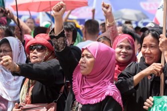 Filipino Muslims women from different part of the nation join peace rally near the presidential palace as a peace pact is signed between the Philippine government and the secessionist Moro Islamic Liberation Front (MILF)