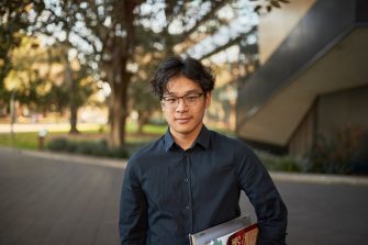 Law student portrait outside, in front of Law Building