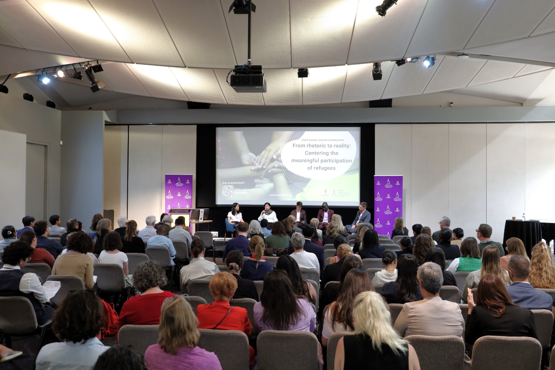 a man dragging a boat to the coast