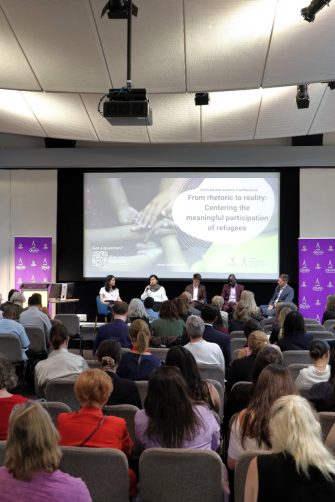 a man dragging a boat to the coast