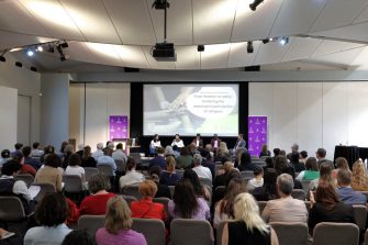 a man dragging a boat to the coast