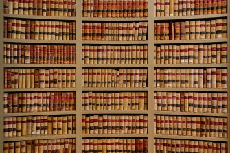 Books on shelves in the Law Library of the Old Mississippi State Capitol building (1839) at 100 S State Street in Jackson, Mississippi on January 14, 2014. This photograph consists of three exposures blended together to create a high dynamic range (HDR) image.