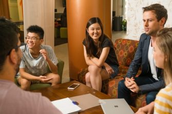students sitting around a coffee table