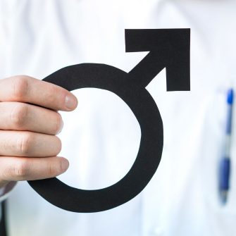 Photo of person holding male symbol