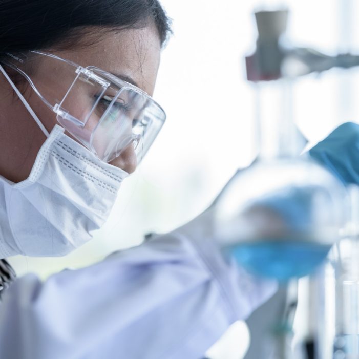 Asian young girl student scientist researching  and learning in a laboratory.