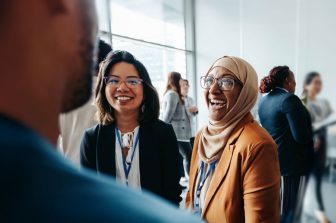 Colleagues chatting at a research event