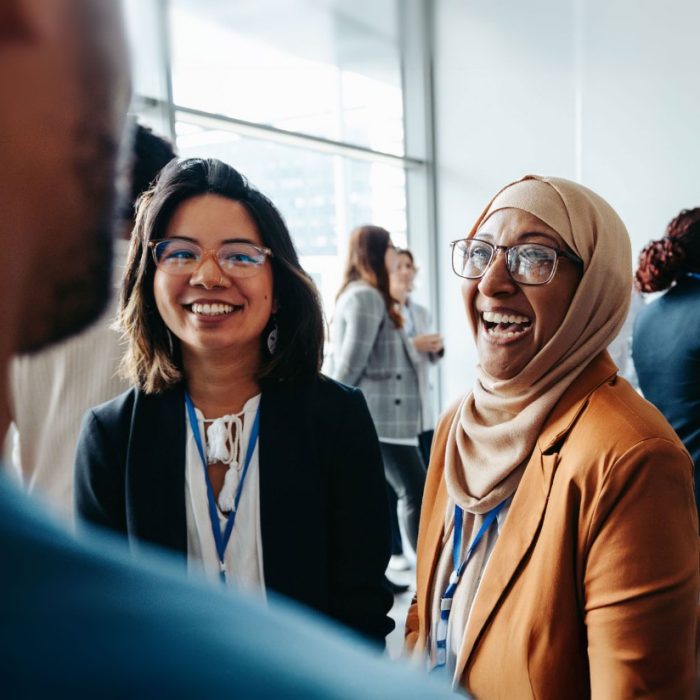 Colleagues chatting at a research event