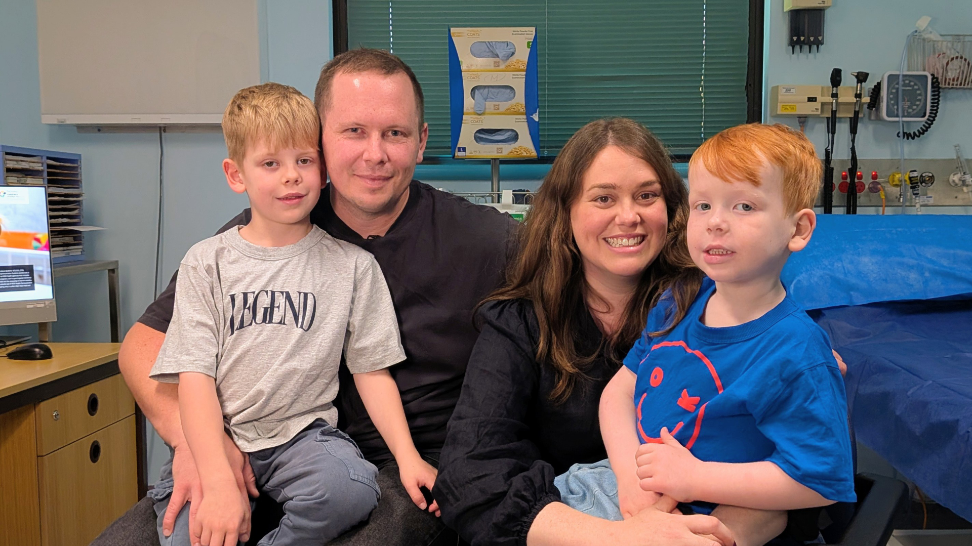 Mitch and Emily, with their two sons. Xavier, right, has spinal muscular atrophy.