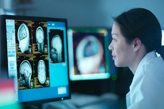 Scientist looking at MRI scan
