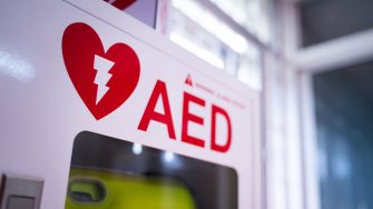 An automated external defibrillator (AED) in a white box is an emergency defibrillator for people in cardiac arrest.
