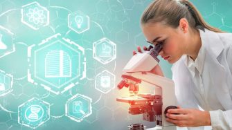 Female researcher observing through microscope