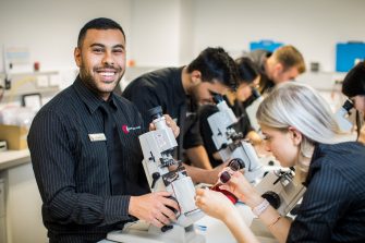 Photograph of science students using microscopes