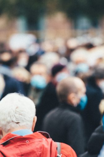Friendly relationship between caregiver and happy eldery woman during nursing at home. Senior services and geriatric care concept.