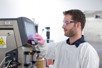 Recombinant Products Facility staff using device to monitor protein and biologics