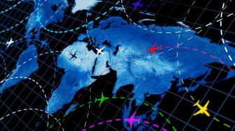 Blue map of world with flight paths mapped on it