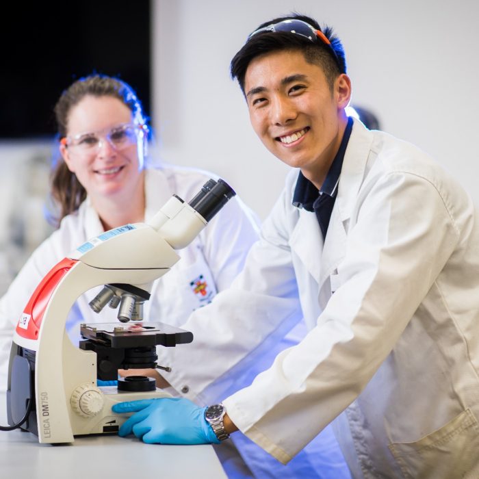 Photograph of students using microscope