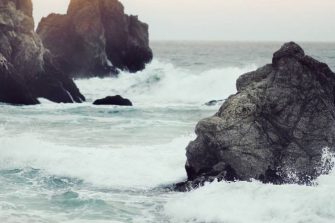 Rocks protruding from rough seas