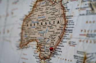 Closeup of a map of Australia with a red pin in Sydney