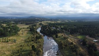 River in Fyshwyck viewed from air surrounded by green fields