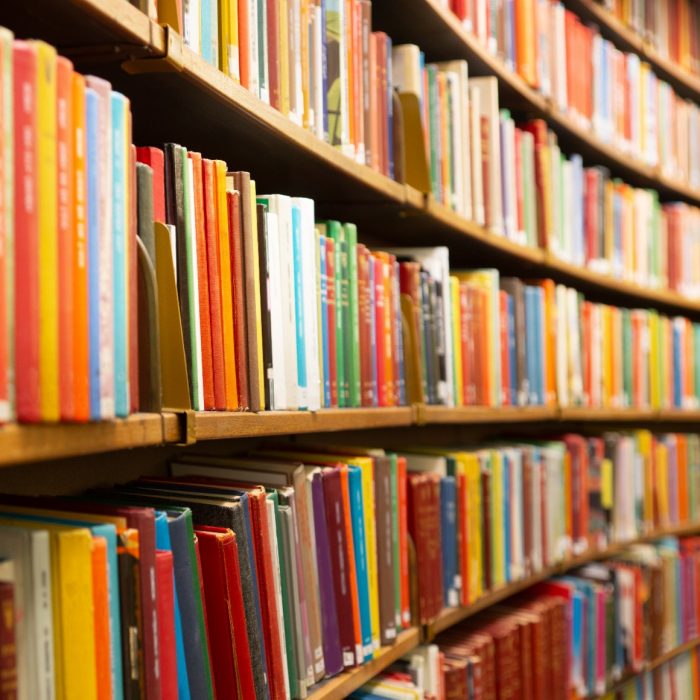 Library with many shelves and books, diminishing perspective and shallow dof