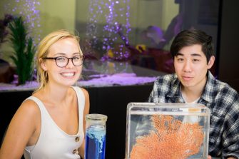 Photograph of science students exaining water organisims and structures