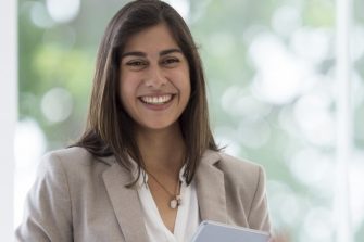 female business lady smiling in group meeting