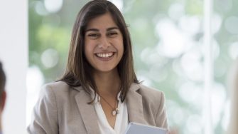female business lady smiling in group meeting