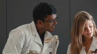 lab students looking at measurement