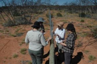 4 person discussion over a fence