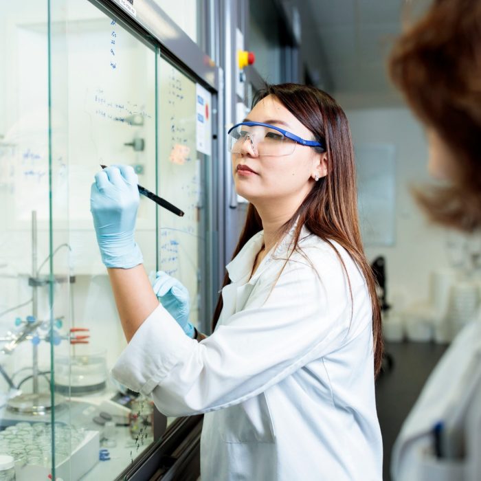 Scientist taking notations