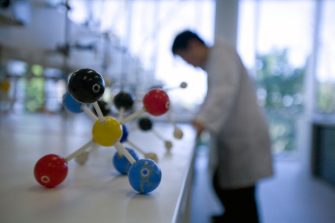 Molecule model on bench in a lab