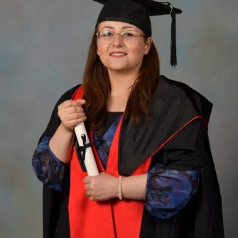 A headshot of a student looking at the camera and smiling.