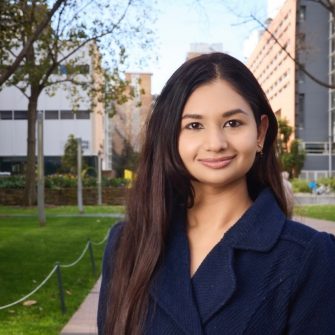 A headshot of a student looking at the camera and smiling.