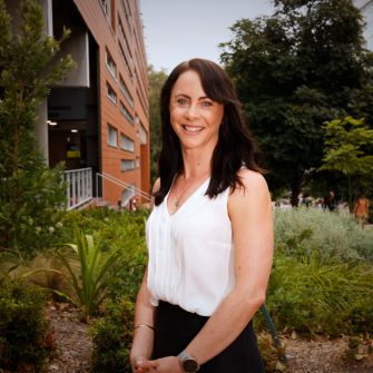 A headshot of a student looking at the camera and smiling.