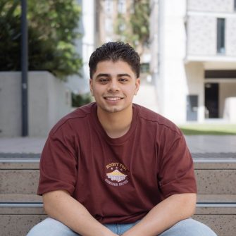 A headshot of a student looking at the camera and smiling.
