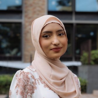 A headshot of a student looking at the camera and smiling.