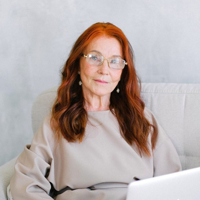 Woman with laptop smiling