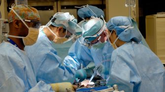 Surgeons in operating theatre