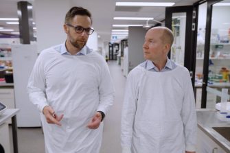 two scientists walking in UNSW lab