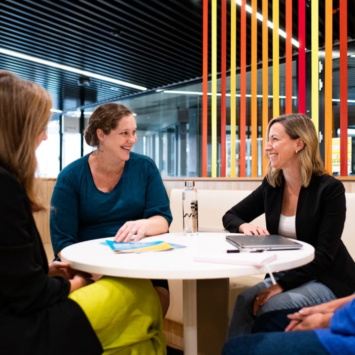 UNSW HR staff sitting around a desk